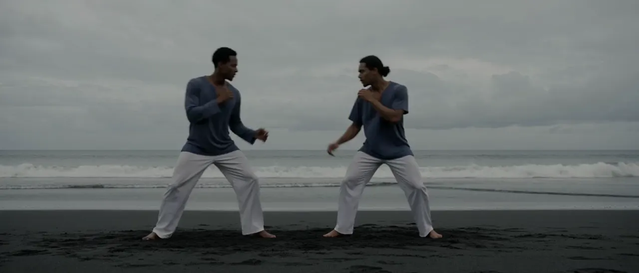 Capoeira on a black beach